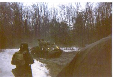 BATTLE OF THE BULGE 1996, TOM GRAY IN FOREGROUND WITH FRANK BUCK'S M4-A3 SHERMAN IN THE BACKGROUND. SNOW ON THE GROUND, BUT IT WAS 50 DEGREES AND RAINING.